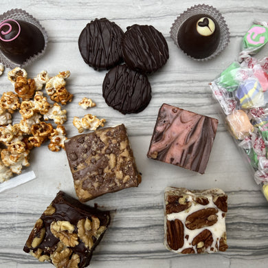 Picture of assorted chocolates, popcorn, and taffy.